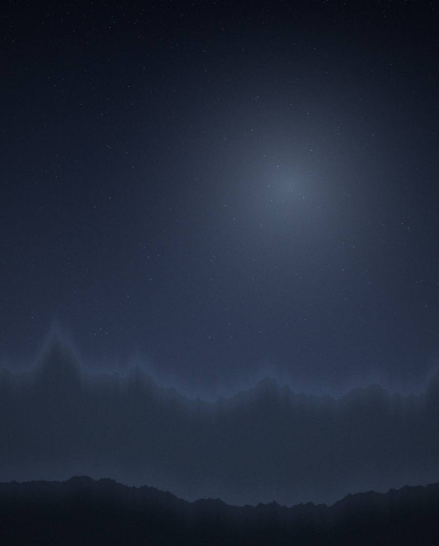 Deep night sky above a snowy valley